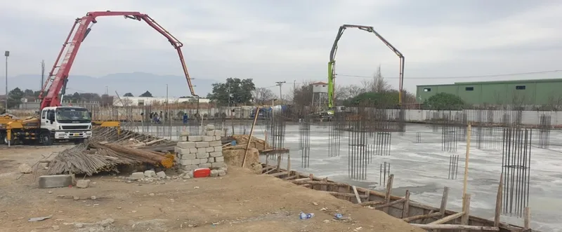 Concrete pumps placing a large raft foundation pour
